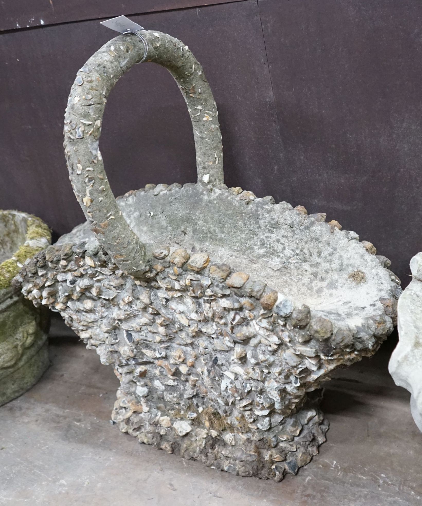 A pebble encrusted reconstituted stone basket garden planter, width 76cm, height 76cm